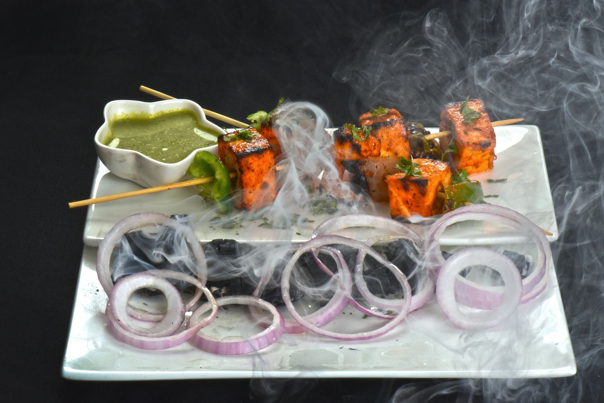 Grilled paneer tikka platter with onions and chutney