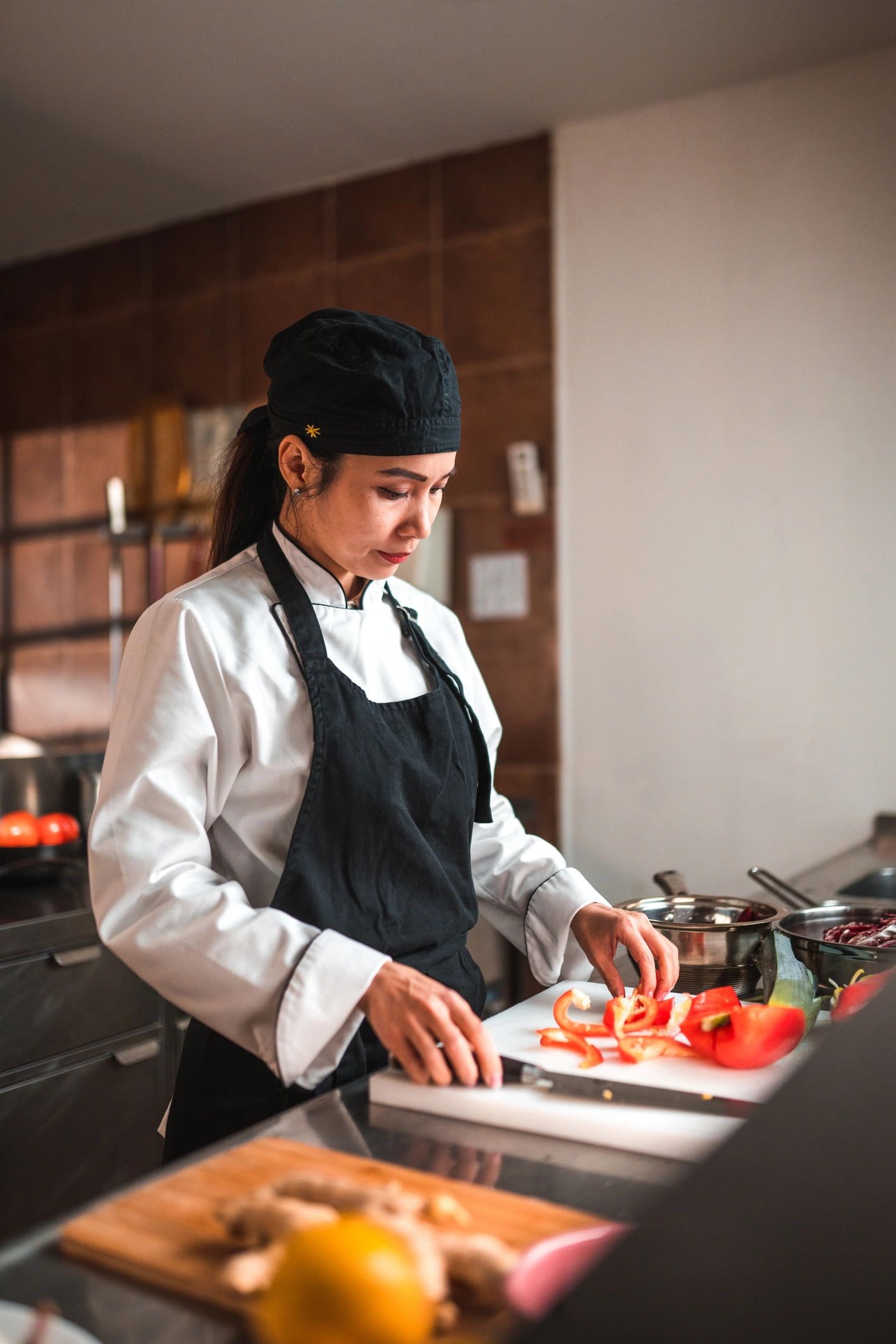 Chef preparing fresh ingredients in a professional kitchen